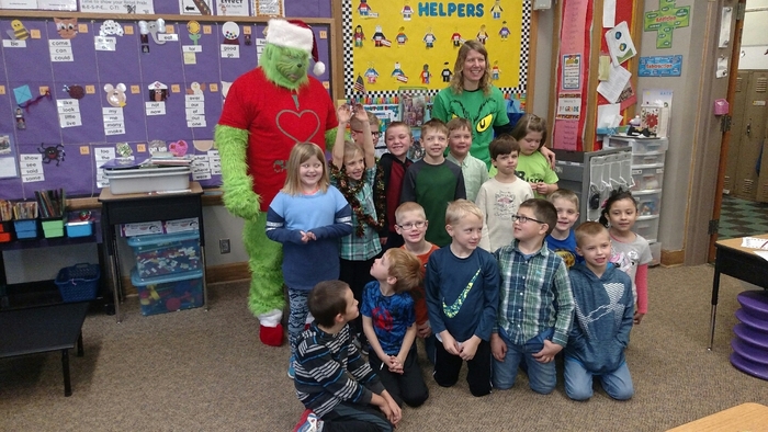 The Grinch visits 1st grade classrooms.